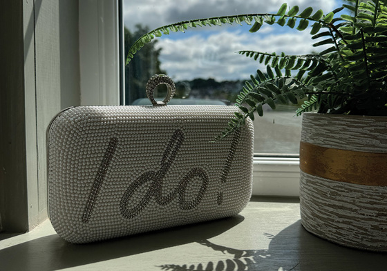 Pearl bag with "I do!" printed on front